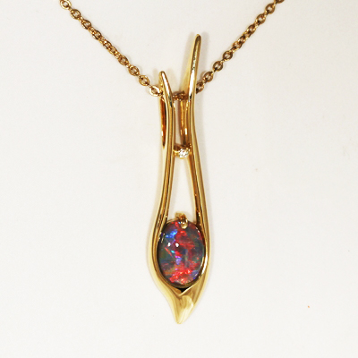 18k Yellow Gold Pendant with a SOLID BLACK OPAL Beautiful fiery red blue, Floral Harlequin pattern, top quality.